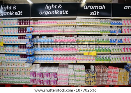 Istanbul, Turkey 18 April 2014: Super Market booth in the light of different brands of milk in dairy products, customers will more easily allow you to choose