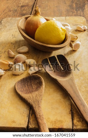 Kitchen cookware and cooking utensils made of wood: spatulas, wooden spoons, cutting boards and cooking.