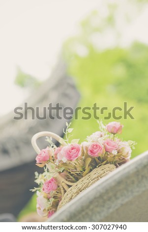 white roses background, shallow depth of field. Retro vintage instagram filter for background and text.