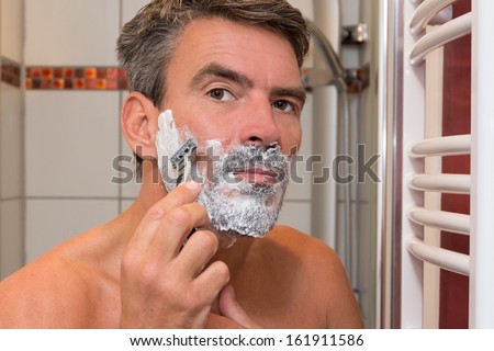 Man shaving wet