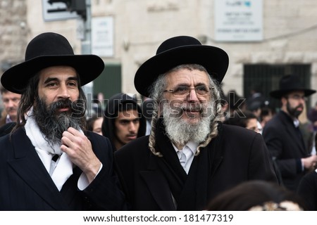 JERUSALEM - MARCH 02: Thousands of ultra-Orthodox jews demonstrate at the entrance to Jerusalem against plans to introduce compulsory military service to the Haredi community at March 02, 2014.