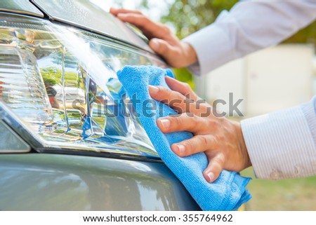 Cleaning headlight with microfiber cloth,car lights