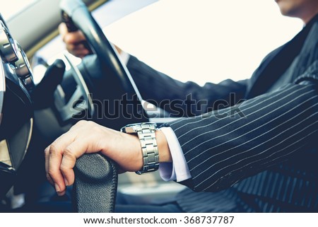 Hand on shifting the gear on car ,man driving car ,businessman ,vintage tone