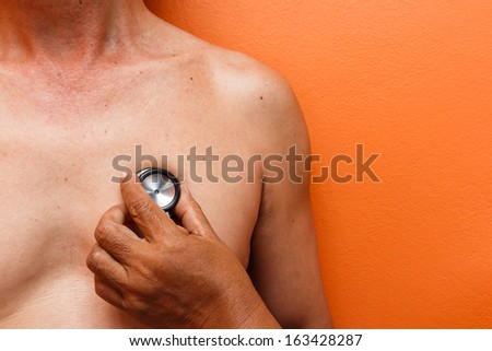 a doctor diagnose patient by black stethoscope
