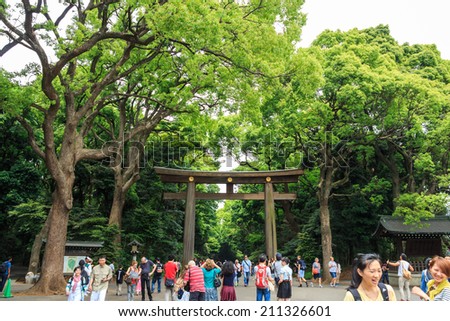 Japan - May 25, 2014  Many people walk through Torii (gate)  in old temple area ,Japan