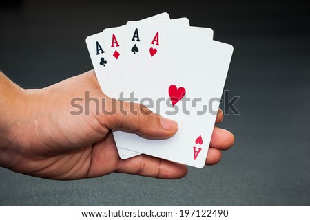 A poker player holding playing cards