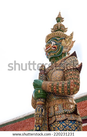 Giant Buddha in Wat Phra Kaeo, Temple of the Emerald Buddha and the home of the Thai King. Wat Phra Kaeo is one of Bangkok\'s most famous tourist sites on white background , Thailand.