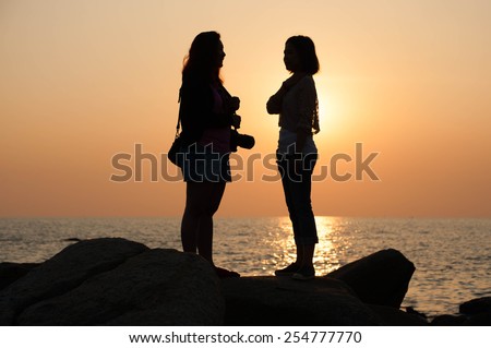 Two girls looking each other angry