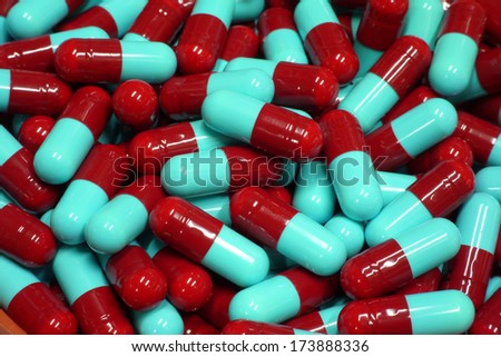red and blue capsules close up
