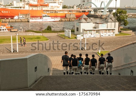 Nagoya, Japan - July 28, 2012 : Japanese students with baseball cloths visit Nagoya aquarium and Fuji Icebreaker boat in Nagoya port