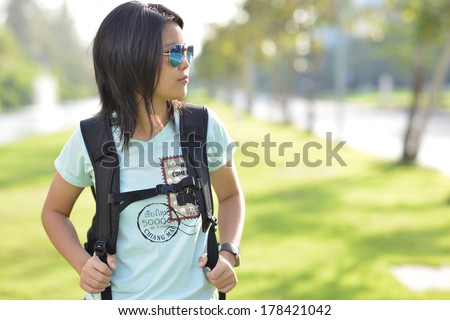Backpacker girl with sun glasses.