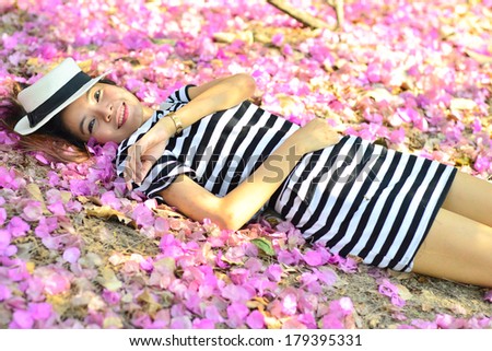 A women lie down on the pink.