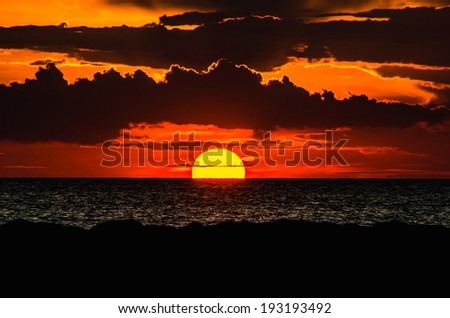 The sunset evening on a vast sea.