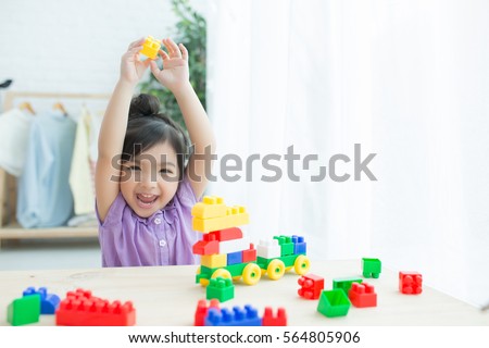 Child Asia girl playing with sorter toys