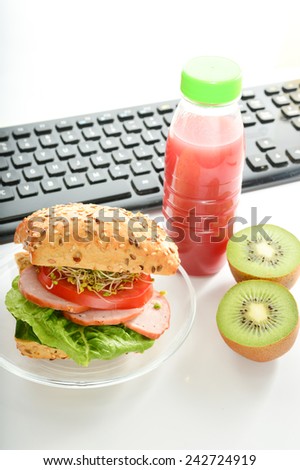 Healthy breakfast, lunch to work. Sandwich with ham and kiwi.
