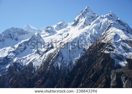The snow peaks of the Himalayas High mountains, snow-capped mountains in a blue sky