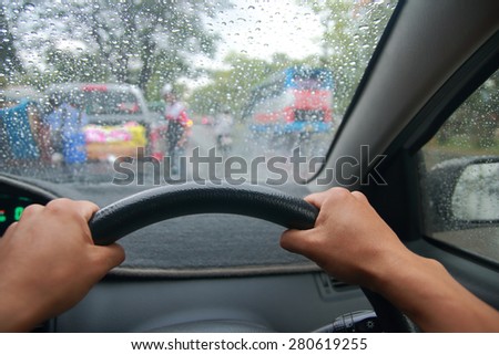 Drive a car during raining, bad weather for drive a car, raining traffic, Driving in rain
