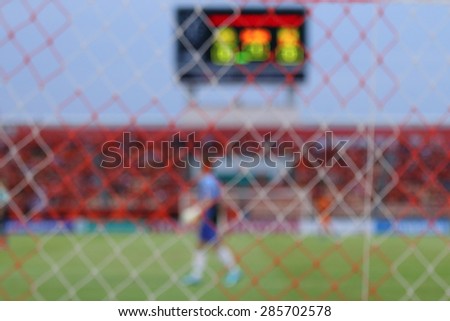 Football tournaments in blurry focus, for background. Behind goal