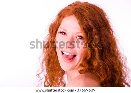 stock photo Pretty redhead girl showing her tongue