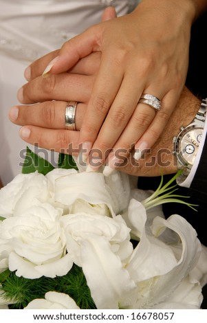 stock photo Bride Groom wearing wedding rings