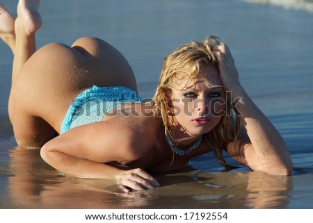stock photo Sexy blonde girl posing half naked on beach naked girl beach