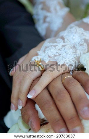 stock photo Bride Groom wearing wedding rings