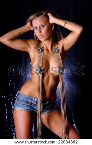 Sexy topless girl posing wearing jean shorts & belt.