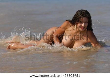 stock photo Beautiful naked woman posing on beach
