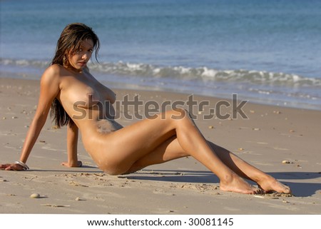 stock photo Naked woman posing on beach