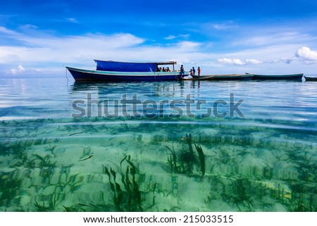 MAIGA ISLAND, MALAYSIA - JUNE 7 : Family of Sea Gypsy (Bajau Laut) living in the boat house June 7th, 2014 in Maiga Island, Sabah, Malaysia. The Bajau Laut are the sea gypsies who live in the open sea