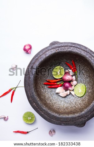 herbs and spices with mortar isolated on white background