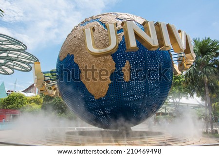 SINGAPORE -AUGUST 07: Tourists and theme park visitors taking pictures of the large rotating globe fountain in front of Universal Studios on AUGUST 07, 2014 in Sentosa island, Singapore