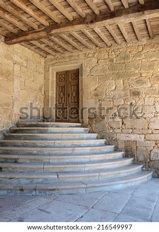 Entrance to the monastery. Detail of the entrance and stairs of an ancient monastery.