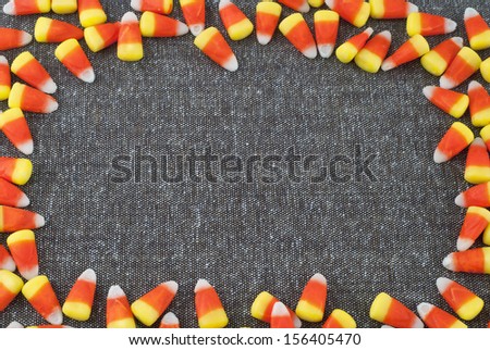 Candy Corn Frame surrounding Tweed Fabric with room or space for text or your words for Halloween or Thanksgiving