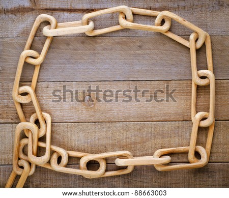 An Old Fashioned Chain Carved from One Piece of Wood on Rustic Background with Room for Text or Your Words