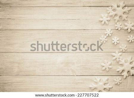 FrostySnowflake Ornaments on Rustic Wood Board Background with empty room or space for copy, text, your words. Horizontal sepia vintage, old-fashion tone