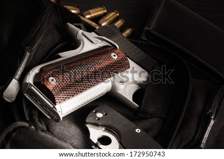 hand gun , knife and bullet