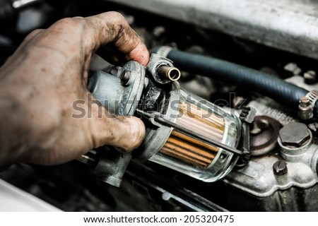 oil filter gas mechanic working in auto repair shop