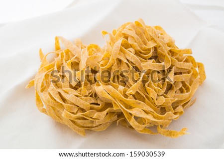 Some handmade tagliatelle: traditional italian egg pasta