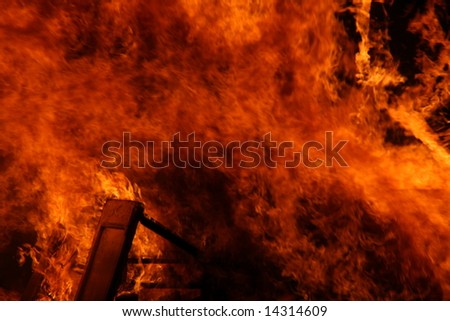 a house burning in flames, accidental fire