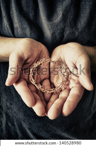 Guy Holding a representation of the famous Crown of Thorns.