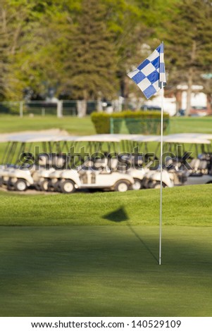 Nice and colorful golf course with flag.