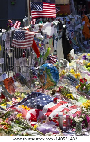 BOSTON, USA - APRIL 21: Locals and tourists left a lot of mementos and messages of courage at the several improvised memorials of the 2013 Boston Marathon bombing along Boylston st on April 21, 2013.