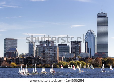 BOSTON, USA - OCTOBER 20: Locals sailing rental boats in the Charles River a few weeks before the end of the sailing season in Boston, Massachusetts, USA on October 20, 2013.