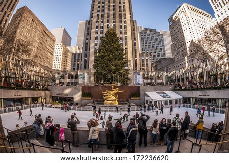 NEW YORK, USA - JANUARY 10: Locals and tourist watching and doing ice skating at one of the most traditional tourist attractions of New York city, the Rockefeller Center Compound on January 10, 2013.