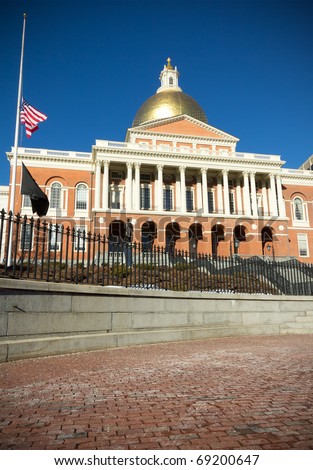 BOSTON - JANUARY 10: One of the most famous landmarks of Boston, the Massachusetts State House, gets visited by hundreds of tourists every year despite the cold weather on January 10th, 2011 in Boston.