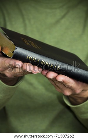 Offering the Holy Bible.