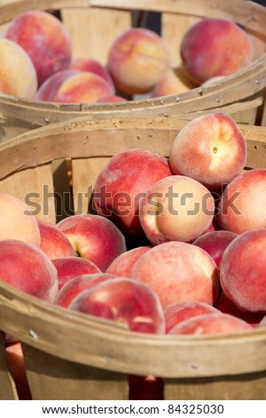 Baskets of peaches for sale at a street market.