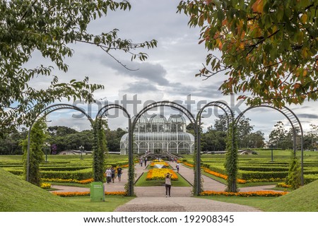 CURITIBA, BRAZIL - APRIL : The greenhouse of Curitiba's botanic garden in Curitiba is a landmark of Parana in Brazil. Seen on a sunny day with locals and tourists enjoying themselves on April 2, 2014.