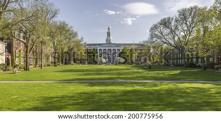 CAMBRIDGE, USA - JUNE 2: Panorama of the Harvard University\'s campus in Cambridge, MA, USA showcasing its historic architecture, gardens and students passing by on June 2, 2014.